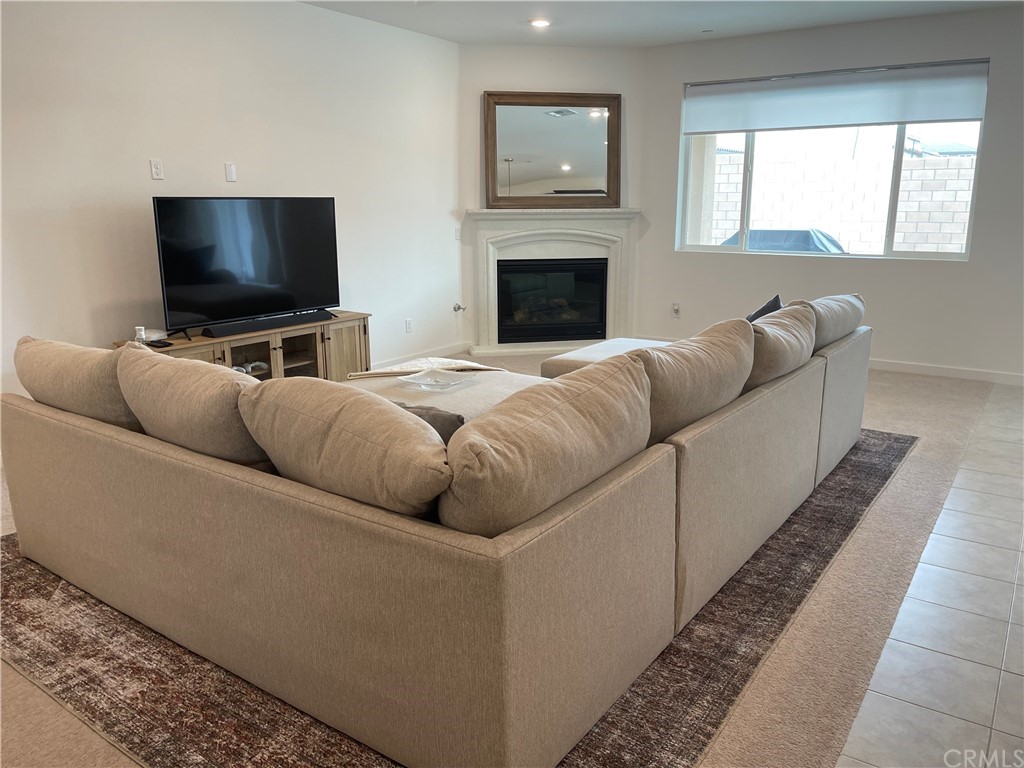 40274 Vivaldi Court Indio, CA 92203 - Photo 6 of 23 a living room with furniture and a flat screen tv
