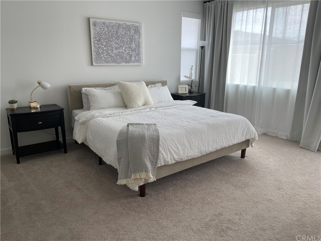 40274 Vivaldi Court Indio, CA 92203 - Photo 8 of 23 a bedroom with a bed and window