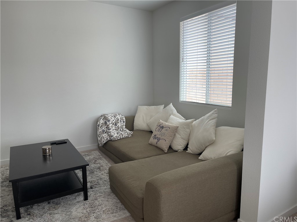 40274 Vivaldi Court Indio, CA 92203 - Photo 9 of 23 a living room with furniture and a window