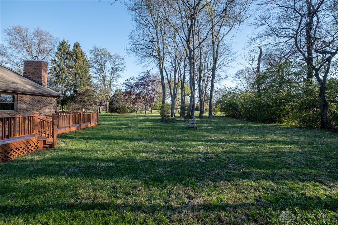 276 South Fairfield Road Bellbrook, OH 45305 - Photo 36 of 38 This spacious yard offers ample outdoor living with a charming deck perfect for entertaining.