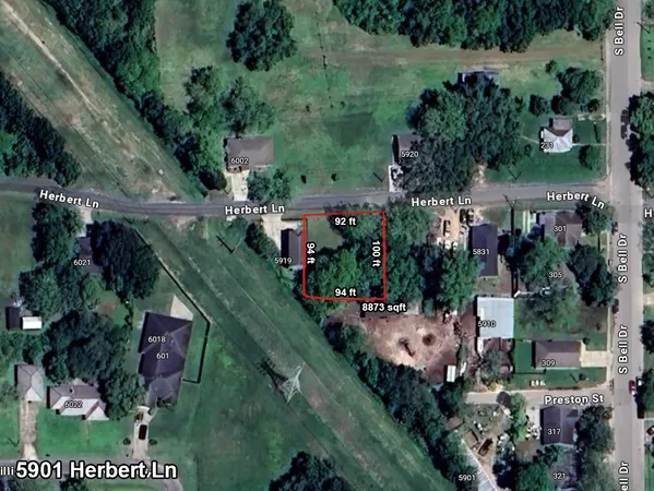 an aerial view of house with yard