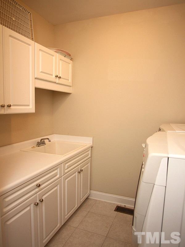 1036 Newburgh Circle Raleigh, NC 27603 - Photo 12 of 25 a utility room with a sink
