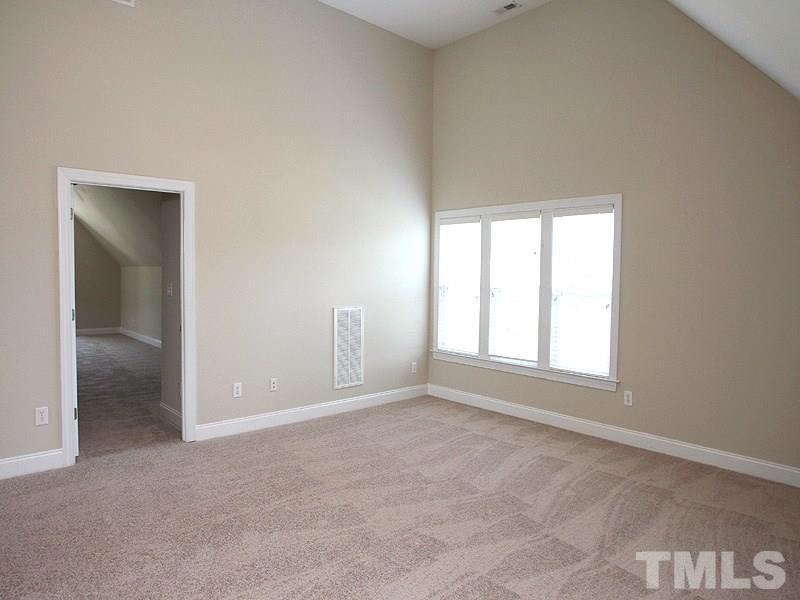 1036 Newburgh Circle Raleigh, NC 27603 - Photo 16 of 25 an empty room with windows and closet