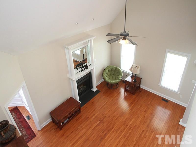 1036 Newburgh Circle Raleigh, NC 27603 - Photo 20 of 25 a living room with furniture and a wooden floor