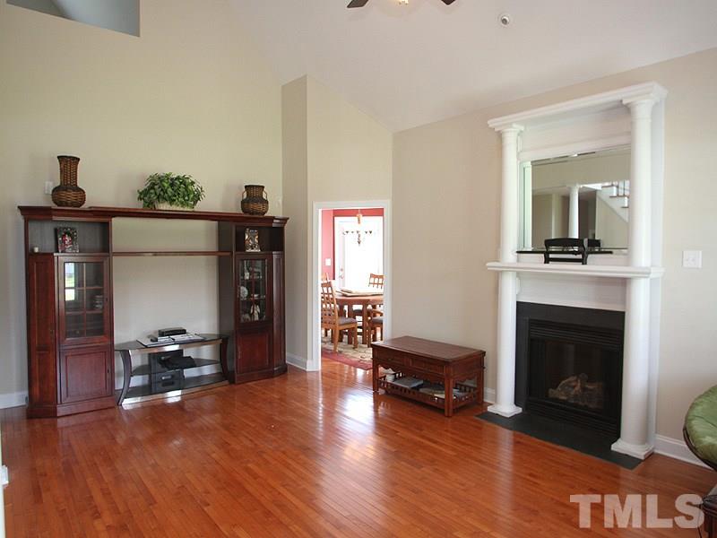 1036 Newburgh Circle Raleigh, NC 27603 - Photo 3 of 25 a living room with furniture and a fireplace