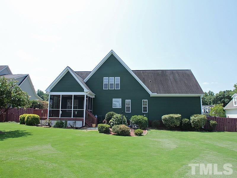 1036 Newburgh Circle Raleigh, NC 27603 - Photo 25 of 25 a front view of a house with a yard and porch