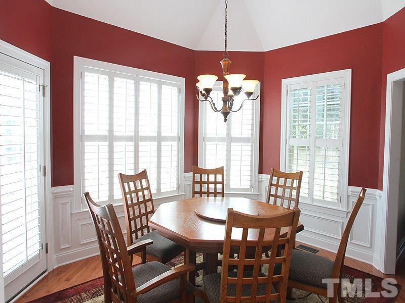 1036 Newburgh Circle Raleigh, NC 27603 - Photo 5 of 25 a view of a dining room with furniture window and wooden floor
