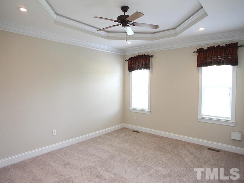 1036 Newburgh Circle Raleigh, NC 27603 - Photo 10 of 25 a view of a livingroom with a ceiling fan and window