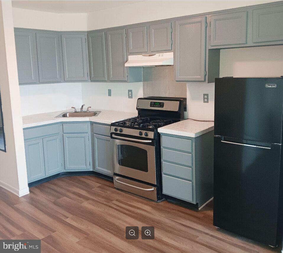 5304 Jackson Street, Unit 2 Philadelphia, PA 19124 - Photo 2 of 6 a kitchen with a stove and a refrigerator