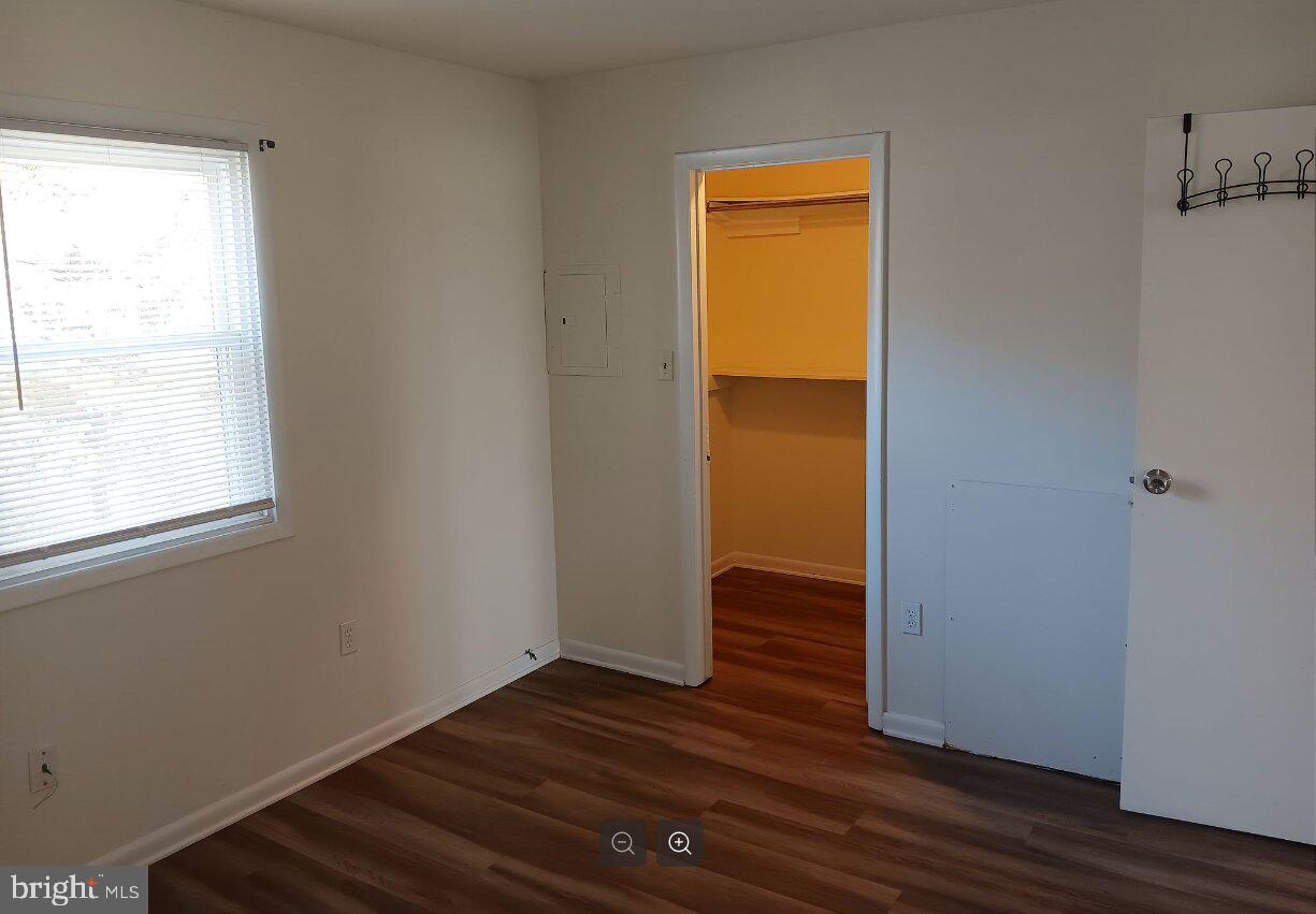 5304 Jackson Street, Unit 2 Philadelphia, PA 19124 - Photo 5 of 6 a view of empty room with wooden floor and fan