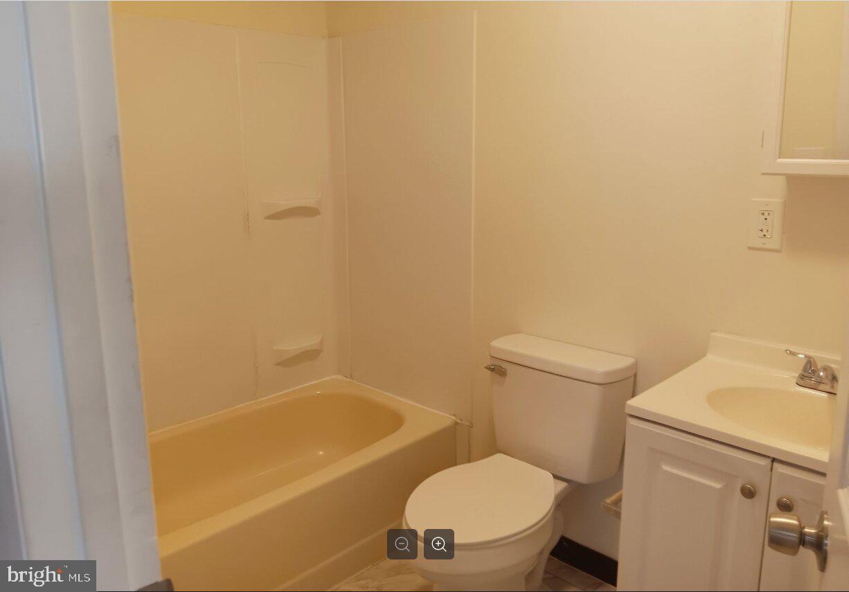 5304 Jackson Street, Unit 2 Philadelphia, PA 19124 - Photo 6 of 6 a white toilet sitting next to a bath tub