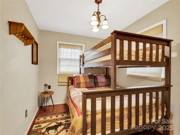 a bedroom with furniture and a window