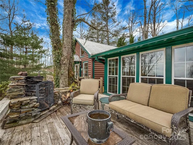 a balcony with furniture and a potted plant