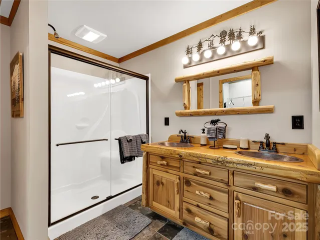 a bathroom with a sink a mirror and cabinets