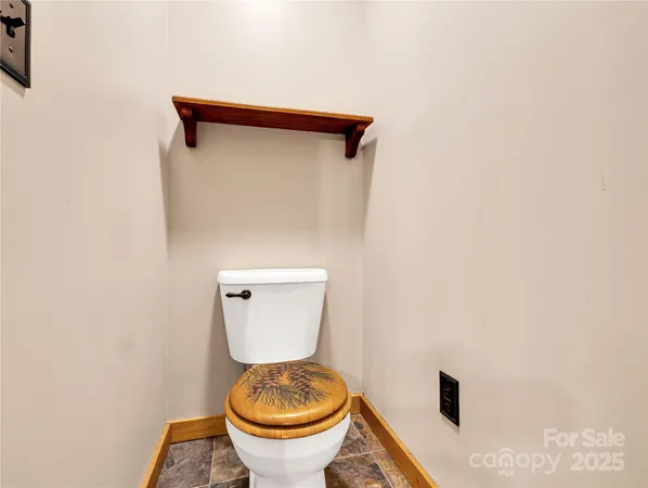 a bathroom with a toilet and a sink
