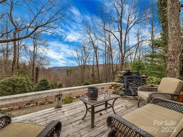 a view of sitting area with furniture and wooden deck