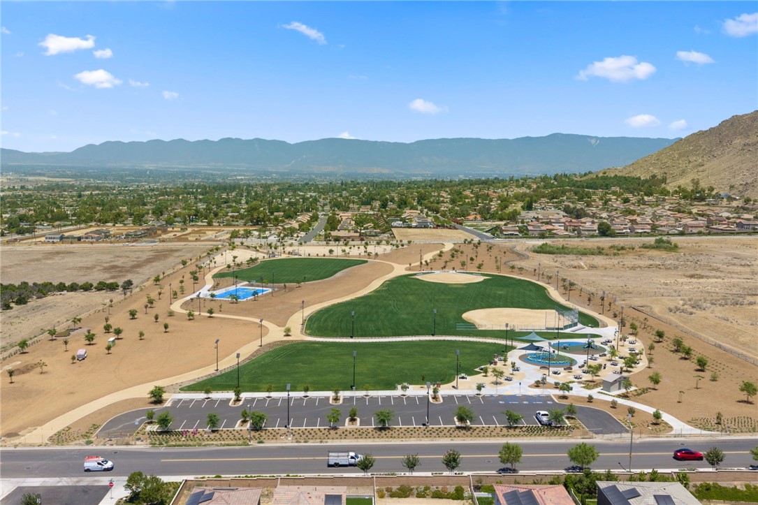 20130 Curaco Court Riverside, CA 92507 - Photo 43 of 43 Aerial neighborhood view featuring nearby park space and surrounding mountains.