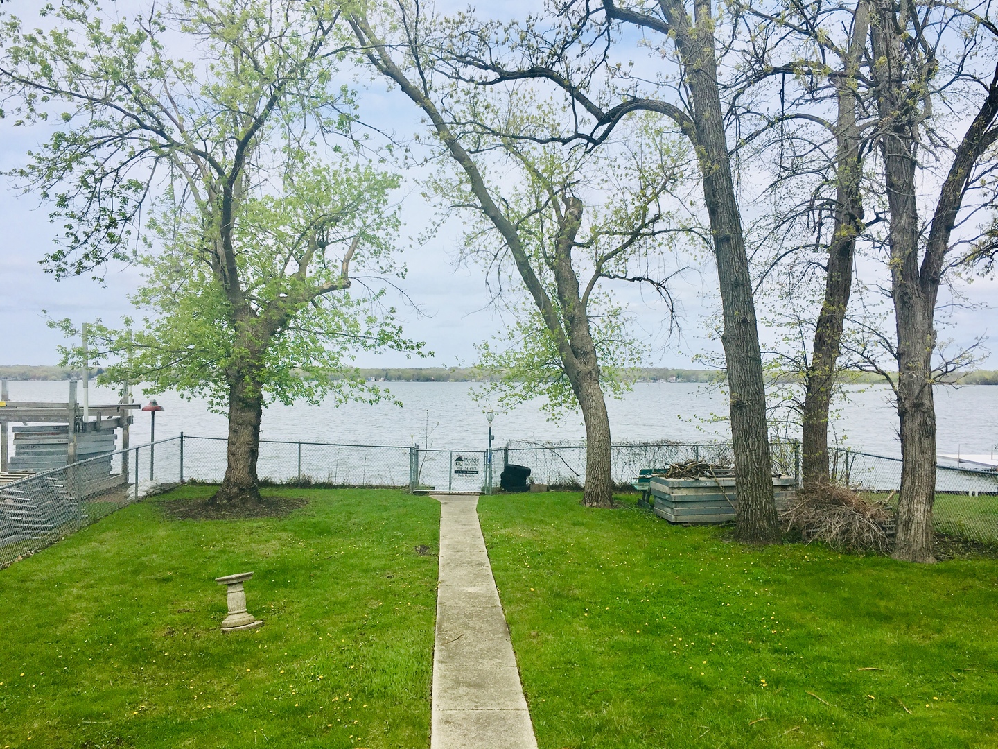 156 Eagle Point Road Fox Lake, IL 60020 - Photo 4 of 57 a view of a backyard with large trees