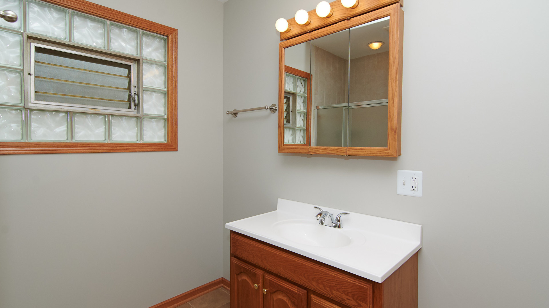 156 Eagle Point Road Fox Lake, IL 60020 - Photo 40 of 57 a bathroom with a sink and a mirror