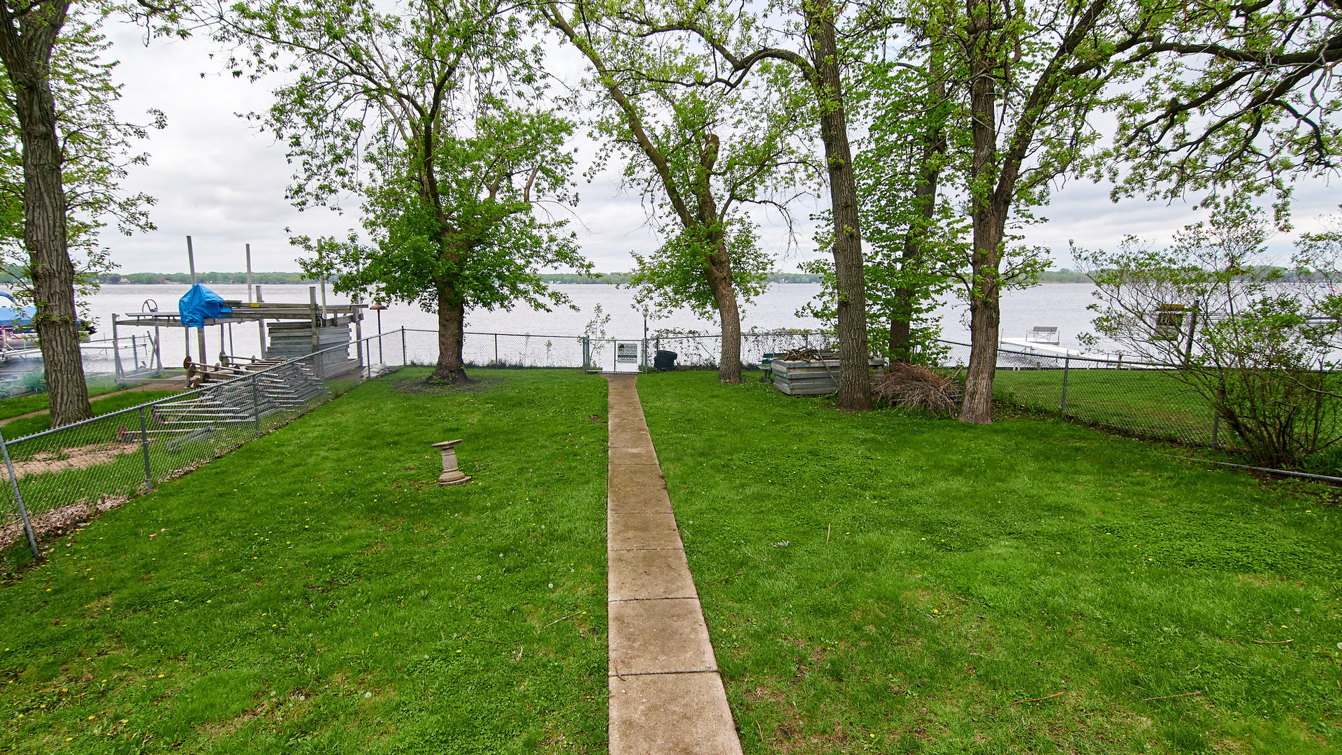 156 Eagle Point Road Fox Lake, IL 60020 - Photo 9 of 57 a view of a backyard with large trees