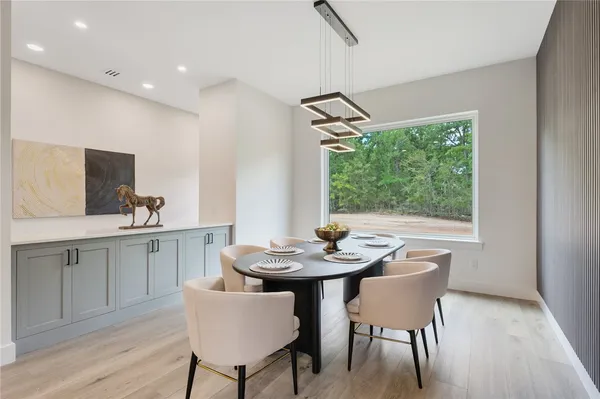 a view of a dining room with furniture window and outside view
