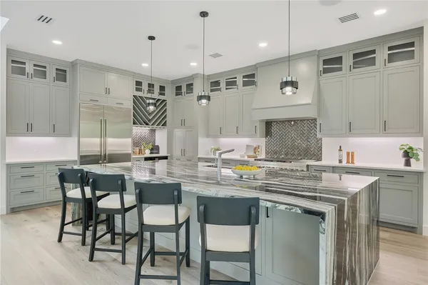 a kitchen with a sink cabinets and window
