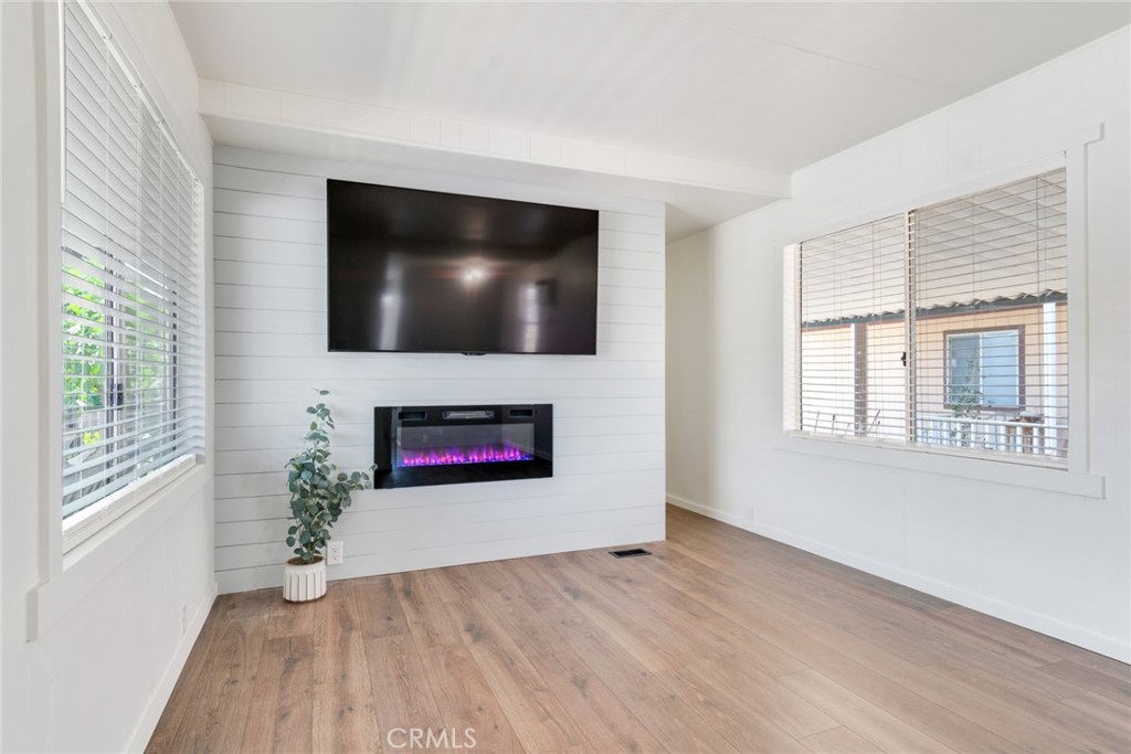 975 California Street, Unit 72 Calimesa, CA 92320 - Photo 7 of 23 a living room with furniture and a flat screen tv