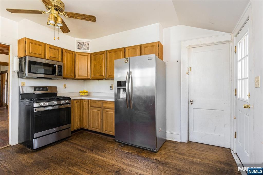 734 Broad Street Bloomfield, NJ 07003 - Photo 11 of 23 a kitchen with stainless steel appliances granite countertop a refrigerator microwave and stove top oven