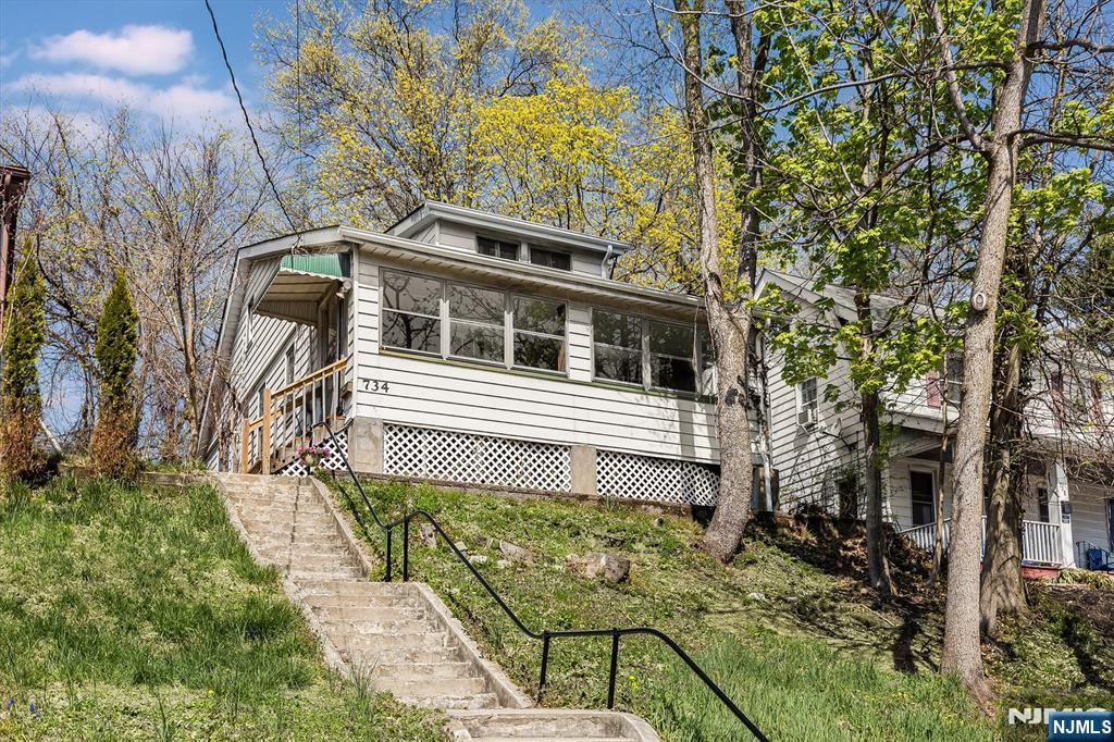 734 Broad Street Bloomfield, NJ 07003 - Photo 23 of 23 a front view of a house with a yard