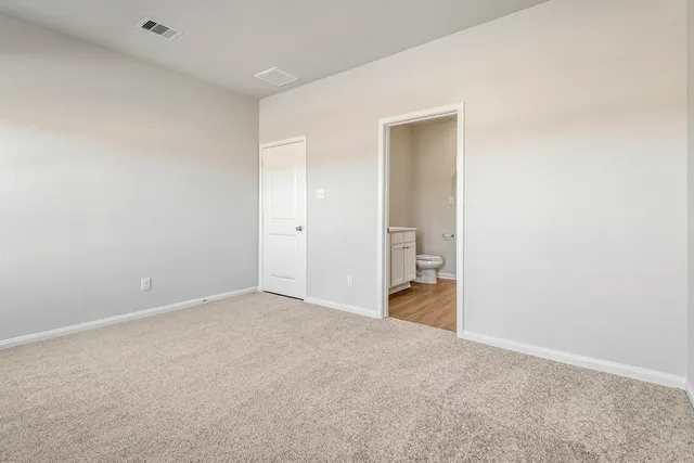 a kitchen with a refrigerator and a sink