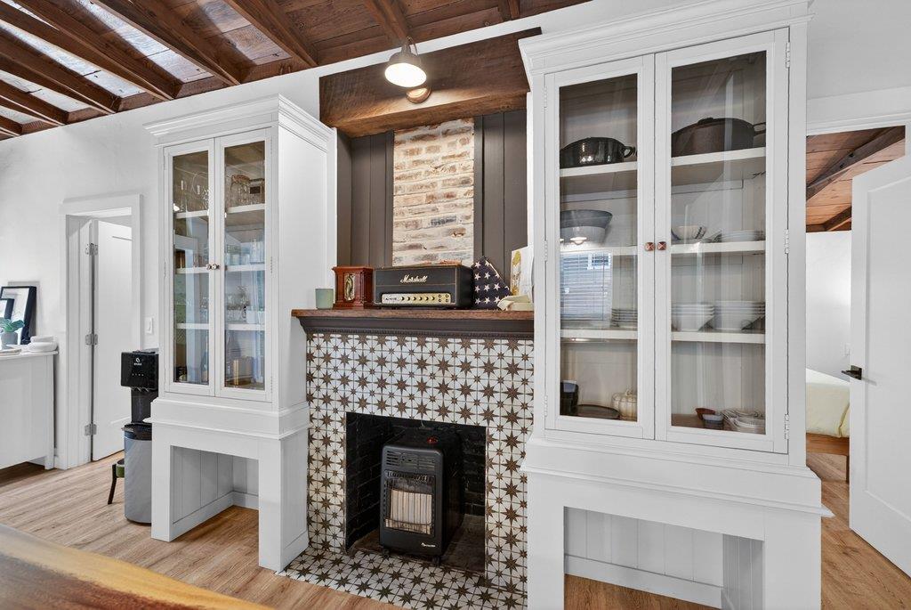 125 Shadowbrook Road Ben Lomond, CA 95005 - Photo 18 of 60 a living room with a fireplace windows and a fireplace