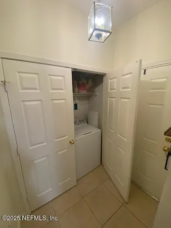a bathroom with a shower and a sink