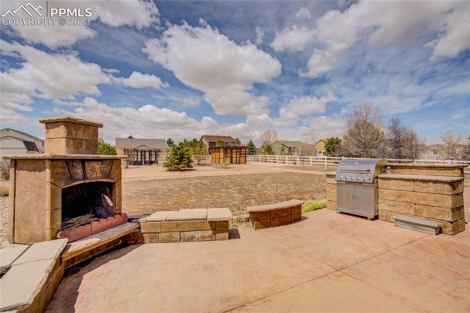 7730 Midnight Road Peyton, CO 80831 - Photo 37 of 50 Custom outdoor fireplace