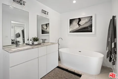 a bathroom with a bathtub and a sink