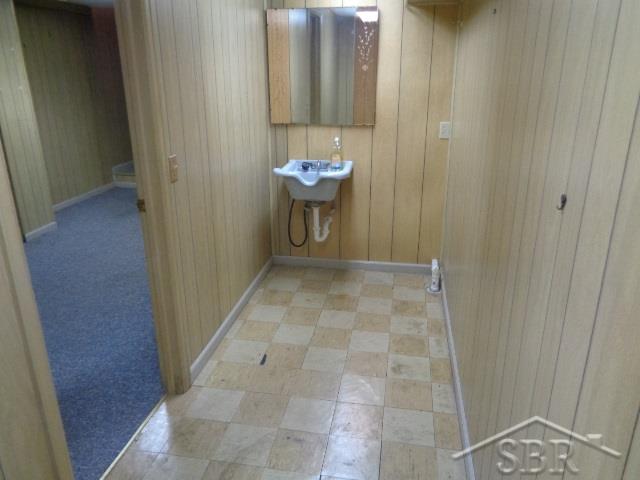1780 North Center Road Saginaw, MI 48638 - Photo 43 of 48 Basement Salon Room with