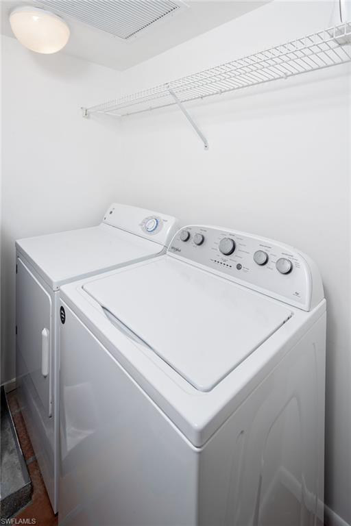 282 4th Street South, Unit 204 Naples, FL 34102 - Photo 9 of 16 a utility room with dryer and washer