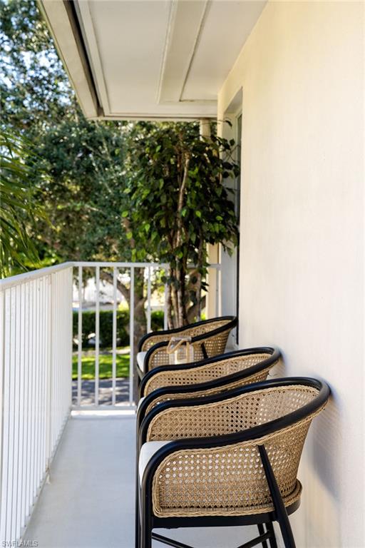 282 4th Street South, Unit 204 Naples, FL 34102 - Photo 10 of 16 a bedroom with a bed and a window