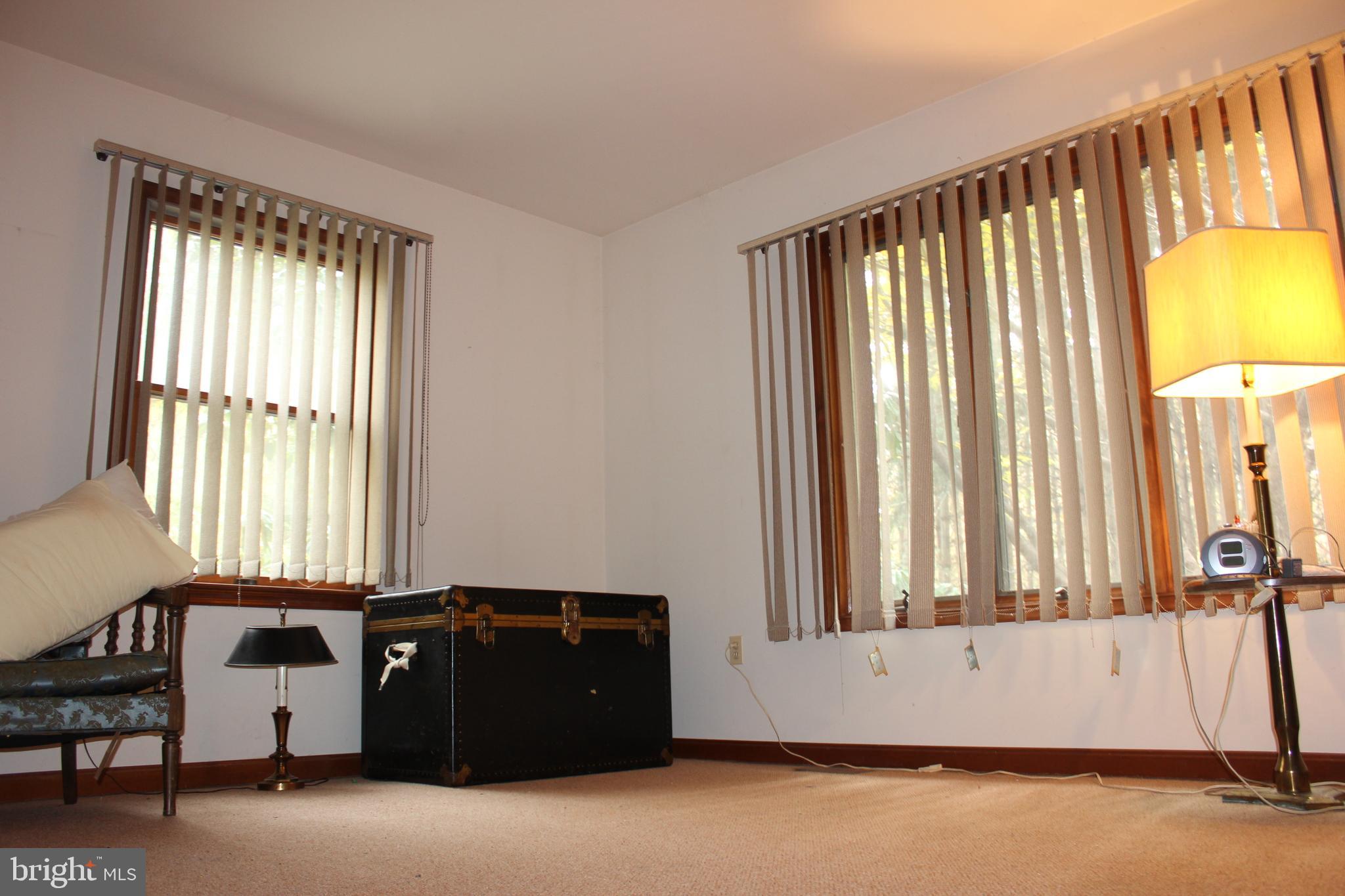5510 Stephen Reid Road Huntingtown, MD 20639 - Photo 21 of 59 a view of a room with a window and a bed