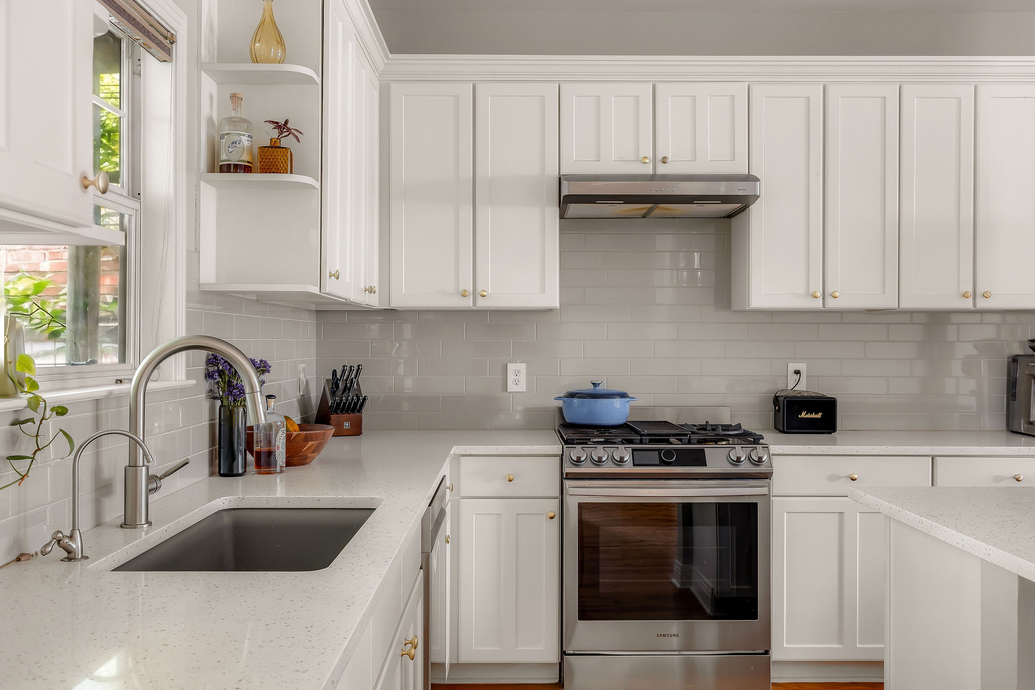 5108 Eilers Avenue Austin, TX 78751 - Photo 24 of 39 Fully updated kitchen with quartz countertops, ample storage, and a spacious island with seating.