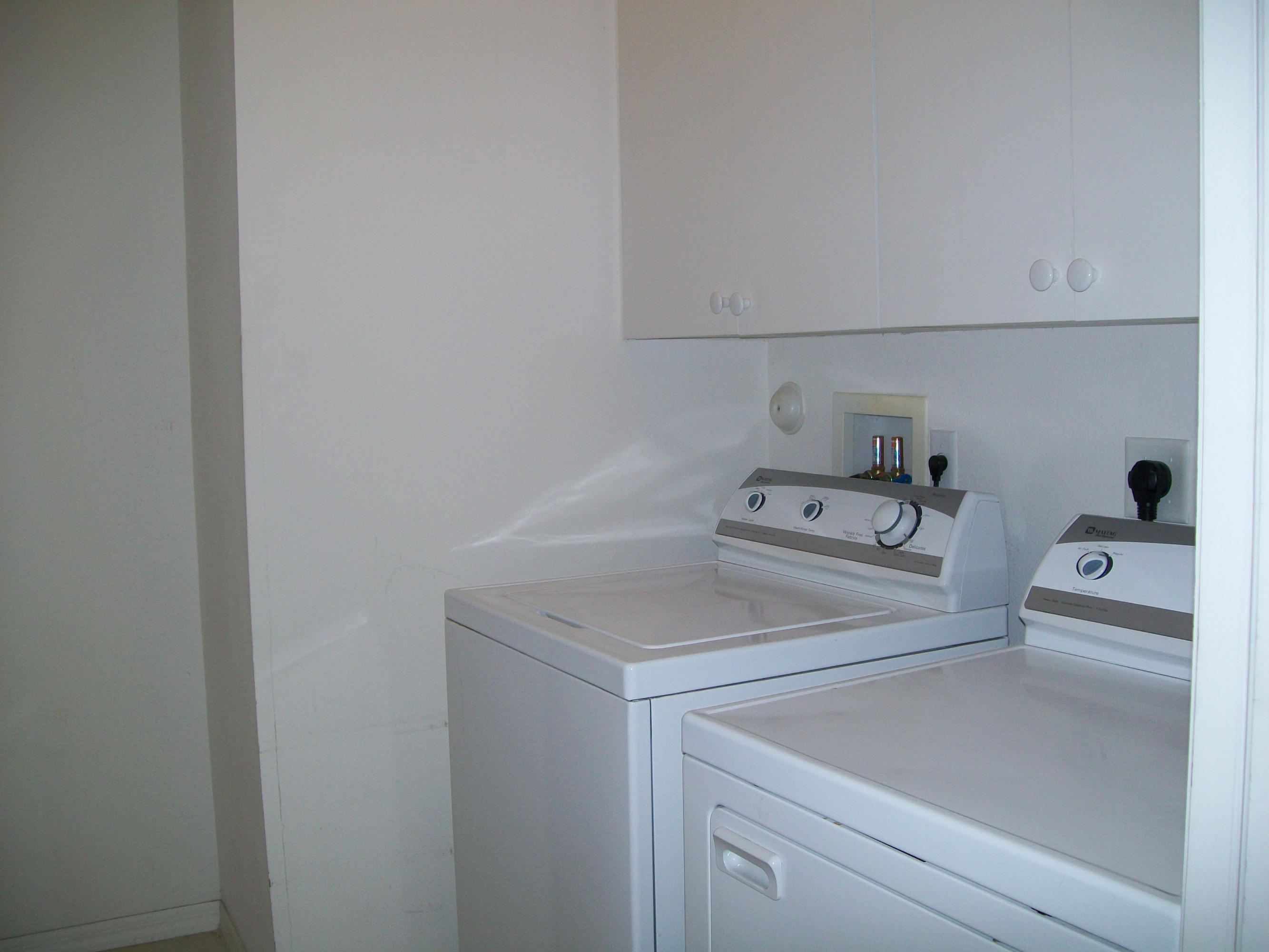 314 Southwest Maclay Way Port St. Lucie, FL 34986 - Photo 15 of 25 utility room with built in cabinets