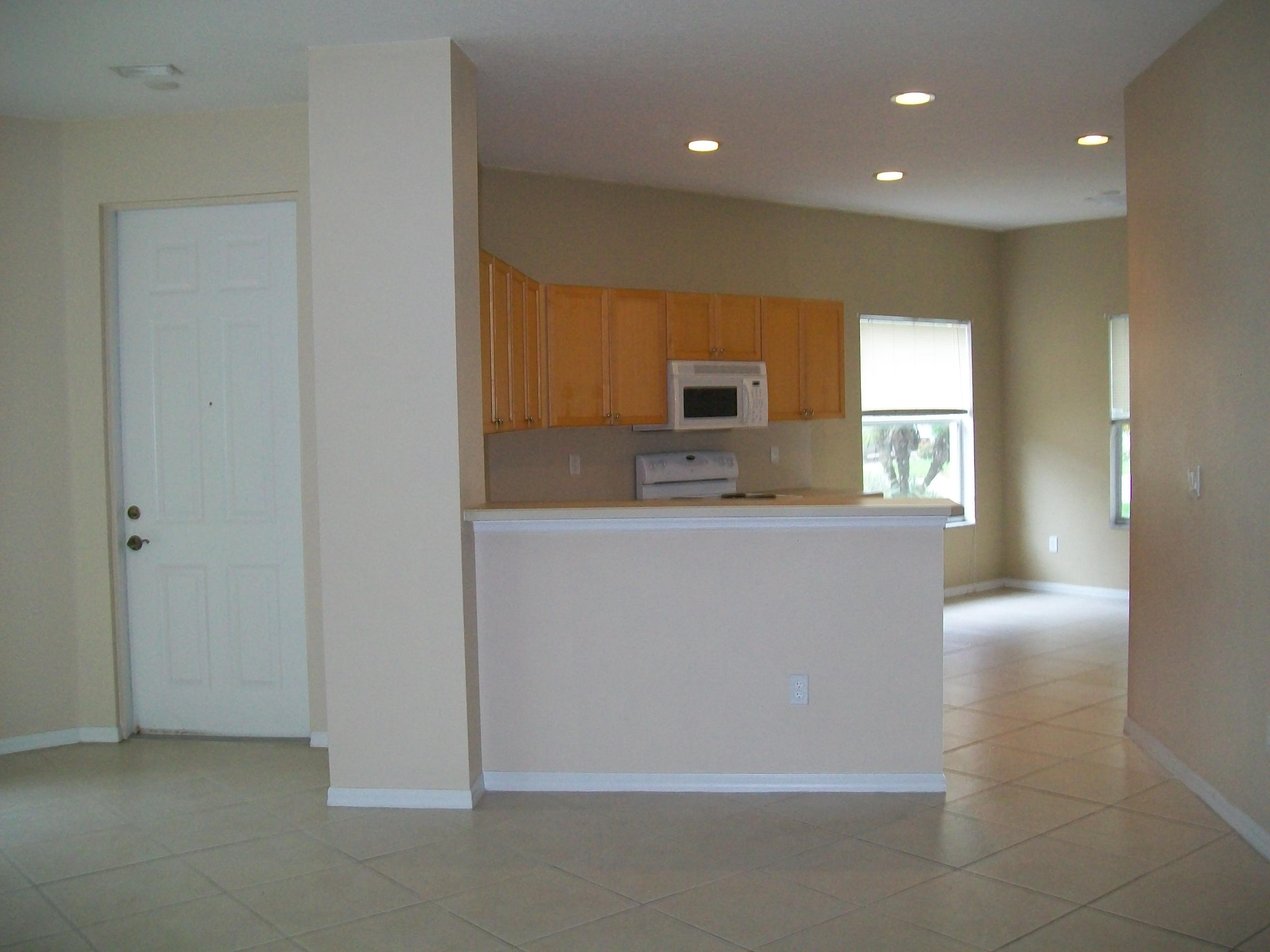 314 Southwest Maclay Way Port St. Lucie, FL 34986 - Photo 3 of 25 from dining area into kitchen
