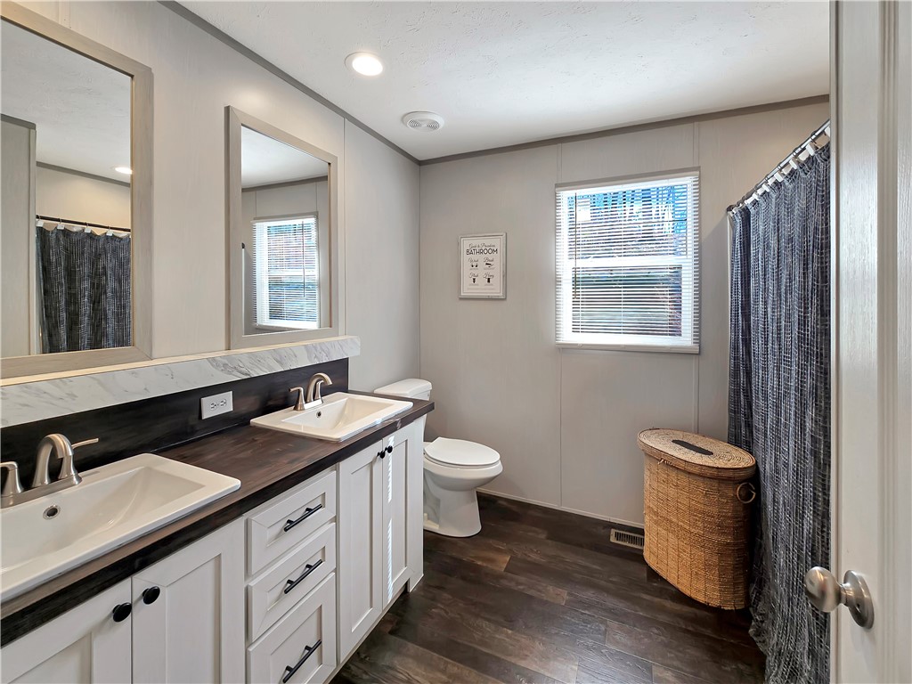615 Generostee Church Road Starr, SC 29684 - Photo 8 of 20 This bright bathroom features a double vanity with ample storage and sleek fixtures.
