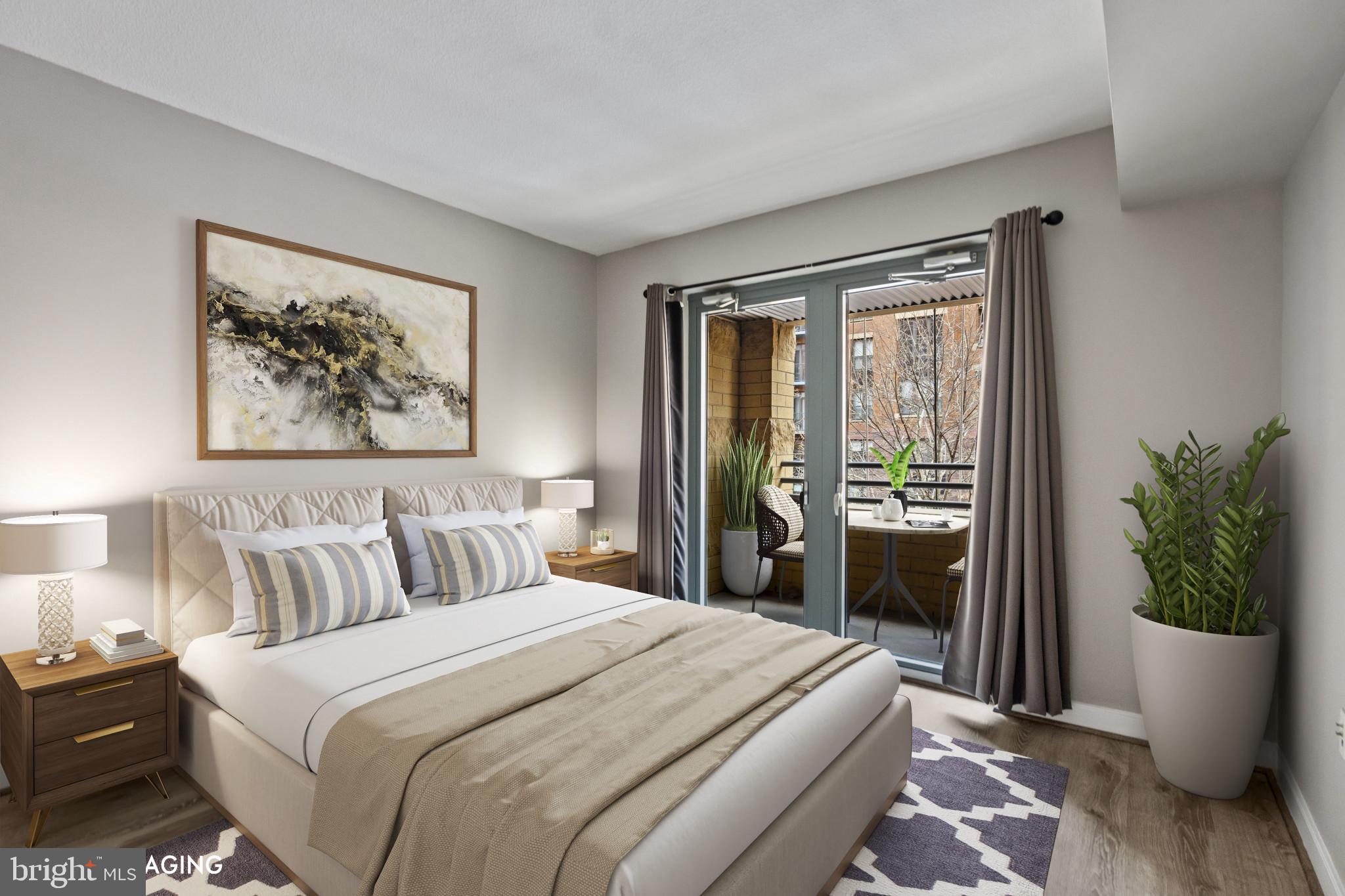 1117 10th Street Northwest, Unit 202 Washington, DC 20001 - Photo 11 of 29 a bedroom with a balcony a bed and a painting on the wall