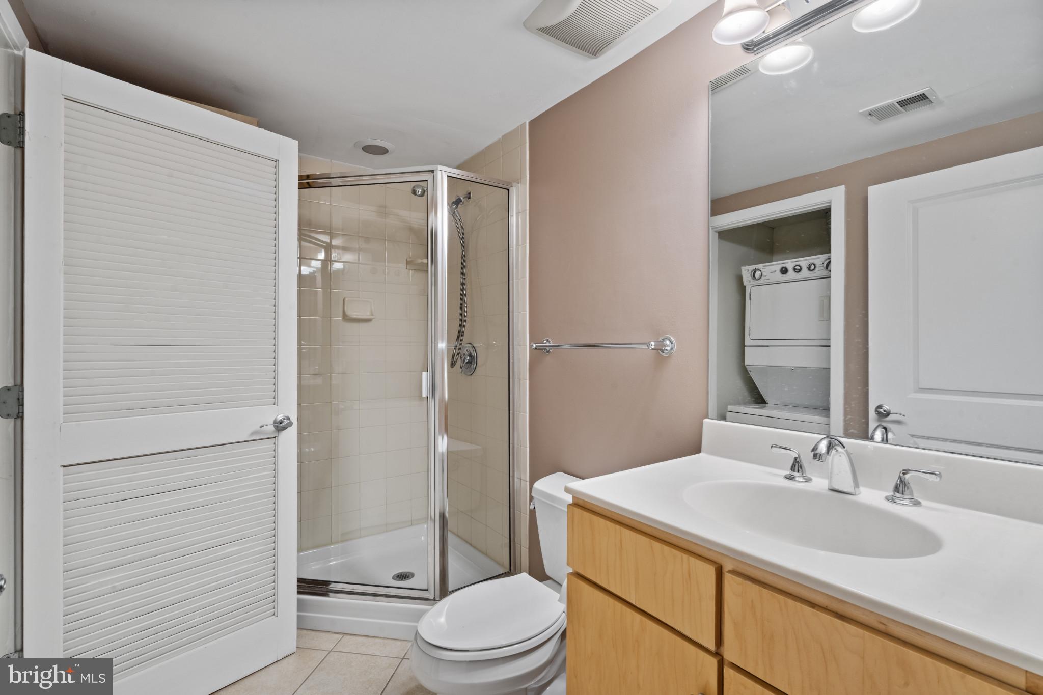 1117 10th Street Northwest, Unit 202 Washington, DC 20001 - Photo 19 of 29 a bathroom with a sink a toilet and shower a mirror
