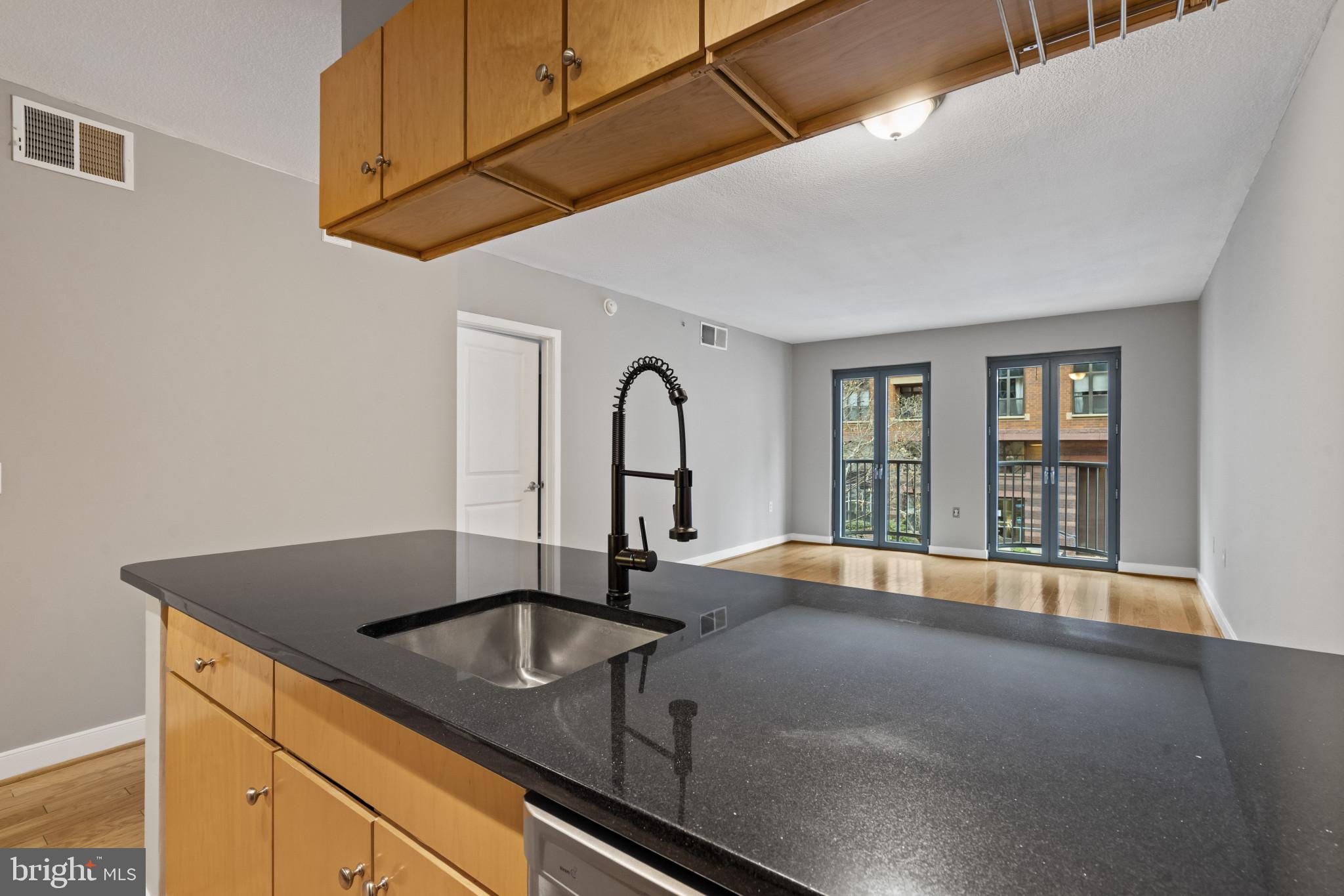 1117 10th Street Northwest, Unit 202 Washington, DC 20001 - Photo 9 of 29 a kitchen with a sink and a window