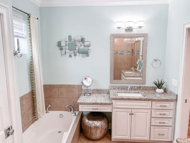 a bathroom with a sink a vanity and mirror