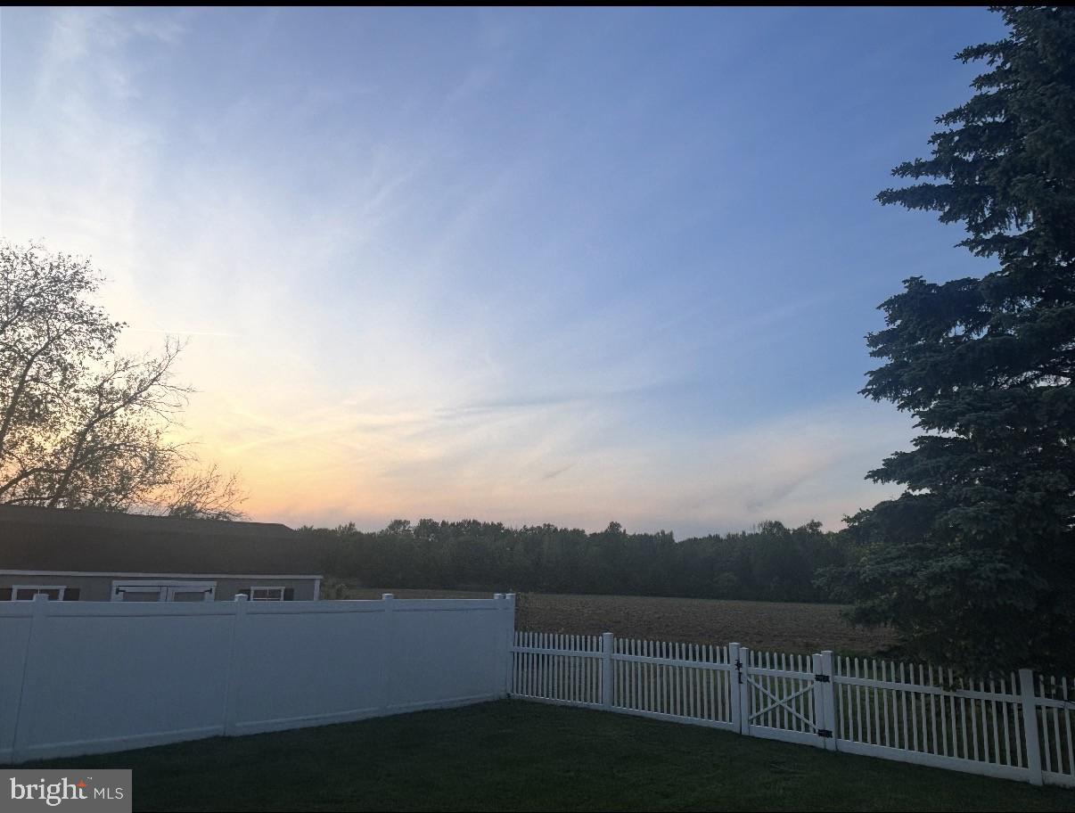 273 Crosswicks Road Bordentown, NJ 08505 - Photo 29 of 31 Tranquil sunset over a serene yard.