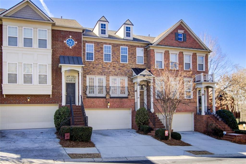 4694 Wehunt Commons Drive, Unit 25 Smyrna, GA 30082 - Photo 1 of 30 a front view of a house with a yard