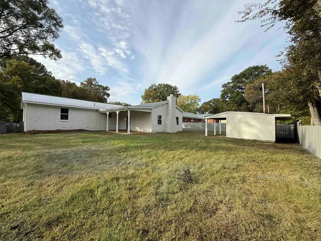 a house view with a garden space