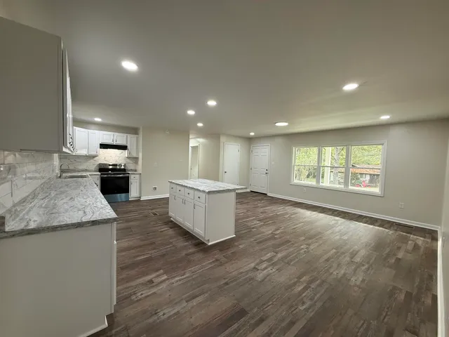 a large kitchen with a large window in it